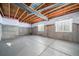 Unfinished basement with concrete floors, exposed ceilings, and window at 42400 Forest Oaks Dr, Elizabeth, CO 80107