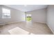 Bright bedroom with hardwood floors, large windows, and sliding door access to backyard at 42400 Forest Oaks Dr, Elizabeth, CO 80107