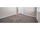 This bedroom features neutral walls, plush patterned carpeting, and white trim at 42400 Forest Oaks Dr, Elizabeth, CO 80107