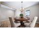 Inviting dining room features a chandelier and hardwood floors, perfect for entertaining guests at 42400 Forest Oaks Dr, Elizabeth, CO 80107