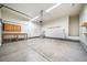 Spacious garage offering ample storage and workshop area with a utility sink at 42400 Forest Oaks Dr, Elizabeth, CO 80107