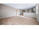 Open-concept living area with hardwood floors and ample space for customization at 42400 Forest Oaks Dr, Elizabeth, CO 80107