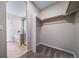 Attached to the bathroom, this walk-in closet features ample storage and organization spaces at 42400 Forest Oaks Dr, Elizabeth, CO 80107