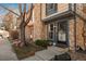 Inviting townhome exterior with a well-maintained lawn and stone facade, showcasing curb appeal at 2927 W 81St Ave # H, Westminster, CO 80031