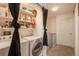 Convenient laundry area with modern washer and dryer and shelving for storage at 2927 W 81St Ave # H, Westminster, CO 80031