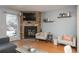 Relaxing living room featuring a corner fireplace, comfortable seating, and natural light at 2927 W 81St Ave # H, Westminster, CO 80031