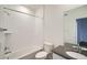 Bright bathroom featuring a shower over tub and sleek vanity with dark countertop and modern fixtures at 14578 W 90Th Ln # B, Arvada, CO 80005