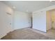 Bright bedroom with neutral carpet, white walls, closet access and natural light from a window at 14578 W 90Th Ln # B, Arvada, CO 80005