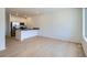 Bright kitchen features modern appliances, a center island with sleek countertops and light wood floors at 14578 W 90Th Ln # B, Arvada, CO 80005