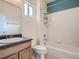 Bright bathroom with a shower-tub combo, a modern vanity, and a large mirror at 11250 Florence St # 20B, Commerce City, CO 80640