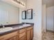 Bathroom with double sinks, modern vanity, and a large mirror, providing ample space at 11250 Florence St # 20B, Commerce City, CO 80640