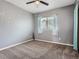 Bedroom with neutral carpet, a window with blinds, and a ceiling fan providing comfort at 11250 Florence St # 20B, Commerce City, CO 80640