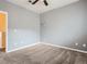 Bedroom with neutral carpet, ceiling fan, and soft decor at 11250 Florence St # 20B, Commerce City, CO 80640