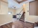 Inviting entryway featuring wood floors and stairway to the upper level with modern interior at 11250 Florence St # 20B, Commerce City, CO 80640