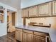 Charming kitchen featuring wood cabinets and eating area with open floor plan at 11250 Florence St # 20B, Commerce City, CO 80640