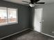 Neutral-toned bedroom with carpet flooring, a ceiling fan, and a window at 20328 E Powers Ln, Aurora, CO 80015