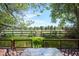 Inviting backyard view from deck showing well-maintained lawn and an unobstructed view of open space at 7582 Powderhorn Dr, Lone Tree, CO 80124