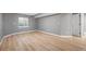 Spacious finished basement features wood flooring, bright lighting, and a neutral color palette at 7582 Powderhorn Dr, Lone Tree, CO 80124