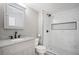 Updated bathroom with a granite countertop vanity and a tiled walk-in shower at 7582 Powderhorn Dr, Lone Tree, CO 80124