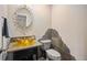 Half bathroom features a vessel sink, stone countertop, and accent wall at 7582 Powderhorn Dr, Lone Tree, CO 80124