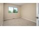 Bedroom with window views and light-colored walls at 7582 Powderhorn Dr, Lone Tree, CO 80124