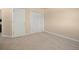 Cozy bedroom with double doors and neutral carpeting at 7582 Powderhorn Dr, Lone Tree, CO 80124