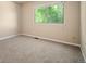 Bedroom with green views from a large window at 7582 Powderhorn Dr, Lone Tree, CO 80124