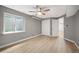 Finished bedroom with a ceiling fan, large window, and closet at 7582 Powderhorn Dr, Lone Tree, CO 80124