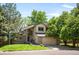 Charming two-story home with a lush landscaped yard and inviting curb appeal at 7582 Powderhorn Dr, Lone Tree, CO 80124