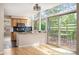 Eat-in kitchen with stone countertops, stainless appliances, and sliding doors to a patio at 7582 Powderhorn Dr, Lone Tree, CO 80124