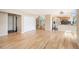 Open floor plan with hardwood floors, a stairway, kitchen, and a living room at 7582 Powderhorn Dr, Lone Tree, CO 80124