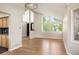 Sun-drenched living room featuring hardwood floors, vaulted ceilings, and large windows at 7582 Powderhorn Dr, Lone Tree, CO 80124