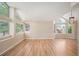 Spacious living room featuring hardwood floors, soaring ceilings, and expansive windows at 7582 Powderhorn Dr, Lone Tree, CO 80124