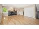 Spacious living room with hardwood floors, gas fireplace, and a closet at 7582 Powderhorn Dr, Lone Tree, CO 80124