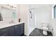 Bathroom featuring a vanity with countertop sink and glass-enclosed shower at 8793 E Monmouth Pl, Denver, CO 80237