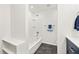 Bathroom featuring a shower over tub with dark floors and a white vanity at 8793 E Monmouth Pl, Denver, CO 80237