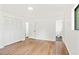 Bedroom with hardwood floors, closet, and ensuite bathroom at 8793 E Monmouth Pl, Denver, CO 80237
