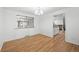 Dining room with hardwood floors, white walls, and bright windows, creating an inviting dining atmosphere at 8793 E Monmouth Pl, Denver, CO 80237
