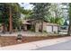 Charming single-story home boasting a brick facade, tiled roof, and a welcoming two-car garage at 8793 E Monmouth Pl, Denver, CO 80237