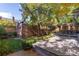 Picturesque backyard with a wooden deck, lush greenery, and a charming fence, creating a private retreat at 815 Gaylord St, Denver, CO 80206