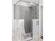 Modern bathroom with a stylish glass-enclosed shower, gray subway tile, and contemporary fixtures at 815 Gaylord St, Denver, CO 80206