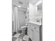 Elegant bathroom featuring a tiled shower, marble floors, and a stylish vanity with modern fixtures at 815 Gaylord St, Denver, CO 80206