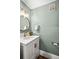 Chic bathroom with a white vanity, gold fixtures, and modern lighting at 815 Gaylord St, Denver, CO 80206