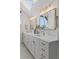Elegant bathroom with double vanity, quartz countertop, and contemporary light fixtures at 815 Gaylord St, Denver, CO 80206