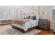 Bright bedroom with hardwood floors, white walls, and stylish furnishings create a serene and inviting space at 815 Gaylord St, Denver, CO 80206