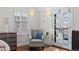 Comfortable sitting area in bedroom with natural light, stylish furniture, and access to the deck at 815 Gaylord St, Denver, CO 80206