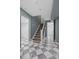 Hallway showcasing black and white tiled floors leading to bathroom and other rooms at 815 Gaylord St, Denver, CO 80206