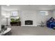 Living room featuring fireplace, plush carpet and bright windows at 815 Gaylord St, Denver, CO 80206