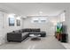 Cozy living room featuring a comfortable gray sectional sofa and a round coffee table on soft carpeting at 815 Gaylord St, Denver, CO 80206