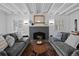 Comfortable living room with a fireplace, hardwood floors, and ample seating at 815 Gaylord St, Denver, CO 80206